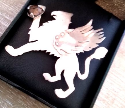 Mythical creature Griffin with citrine in its claw